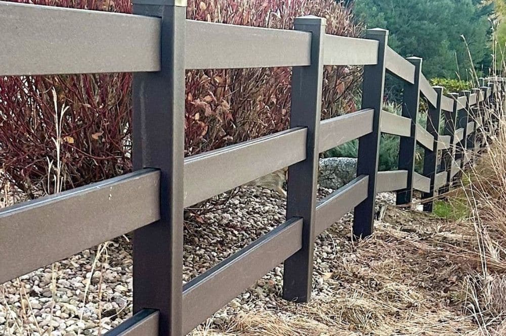 Composite fence showcasing effective farm fencing solutions for agricultural properties